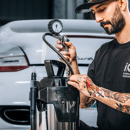 Man using a IK Window Tinting and PPF Sprayer Stainless Steel 13L on front or Porsche Turbo