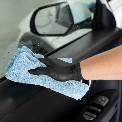 Koch Chemie The Finisher InsideCare Interior Plastic Care being wiped of door card