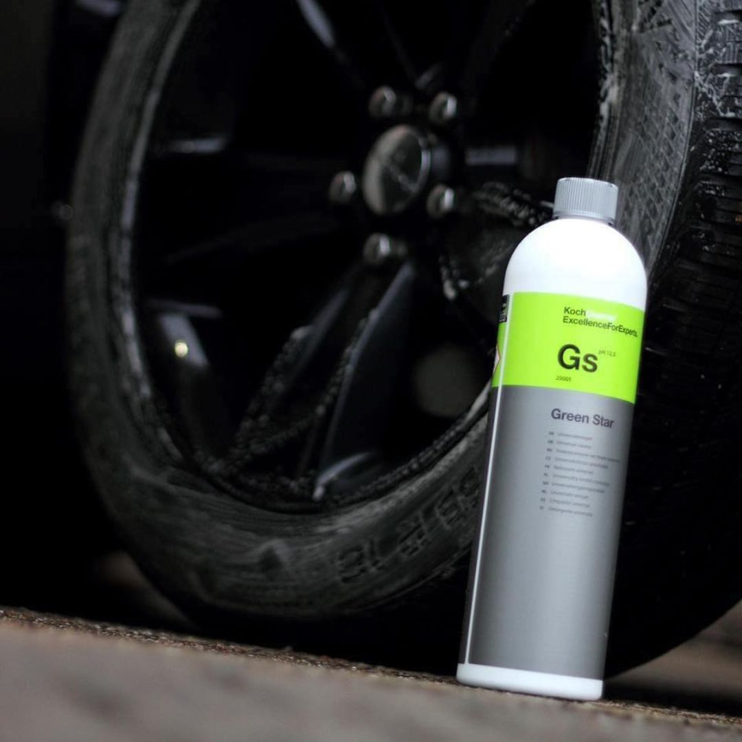 Bottle of Green Star GS product next to a car tire