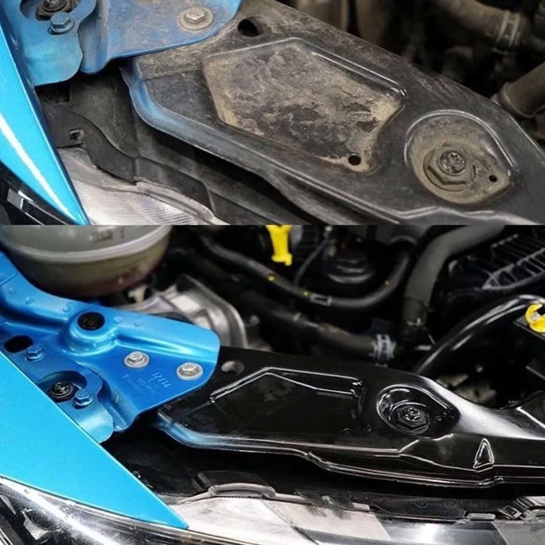 Close-up of a car engine cleaned with Koch Chemie Green Star GS with a blue component and oil pan.