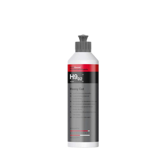 A bottle of Koch Chemie “H9.02. Heavy Cut” polishing compound on a white background.