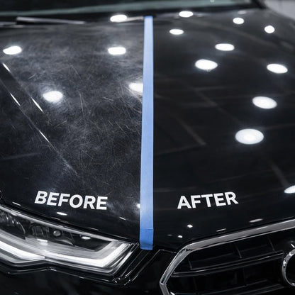 Close-up of a black car bonnet showing a before-and-after comparison, with scratches visible on the left side labeled BEFORE and a cleaner, polished surface on the right side labeled AFTER, divided by a vertical blue tape line. made by Koch Chemie “H9.02. Heavy Cut” polishing compound .