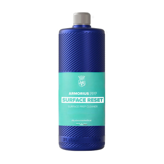 A 1L bottle of Labocosmetica Armorius Surface Reset surface prep cleaner, featuring a textured blue bottle with a teal label and a grey cap, shown on a white background