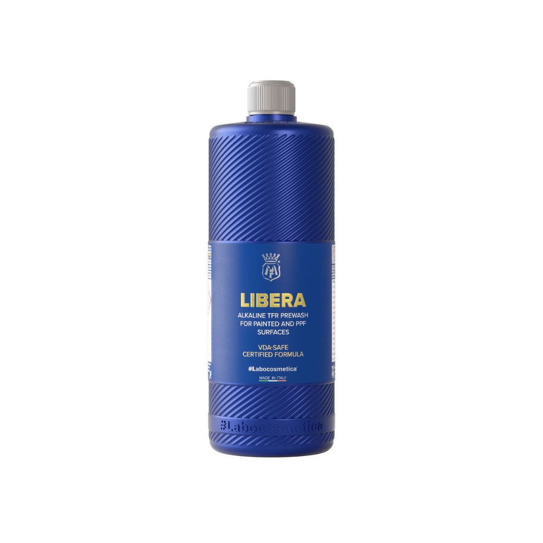 Blue bottle of Labocosmetica Libera on a white background