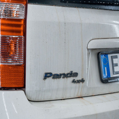 Back of a white Fiat Panda and license plate.