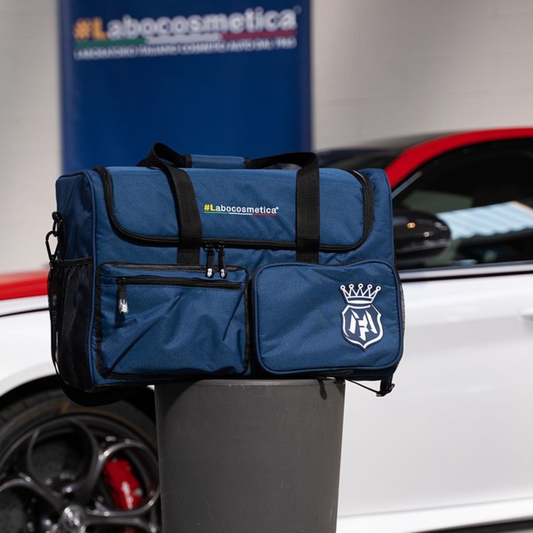 Blue bag with Labocosmetica branding on a car stand