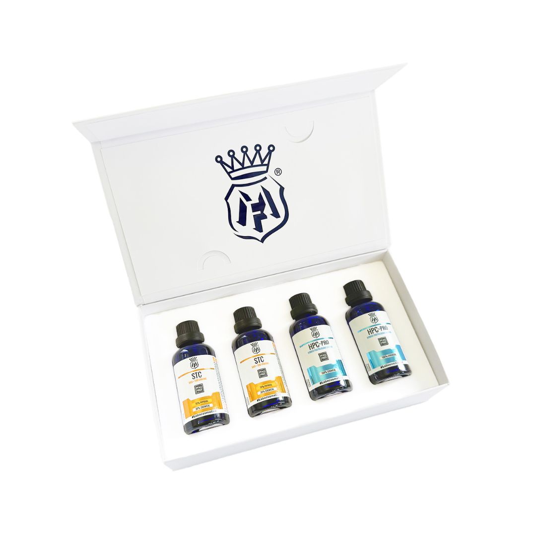 Set of four Labocosmetica ceramic coating bottles STC and HPC Pro with labels in a white box featuring a logo,