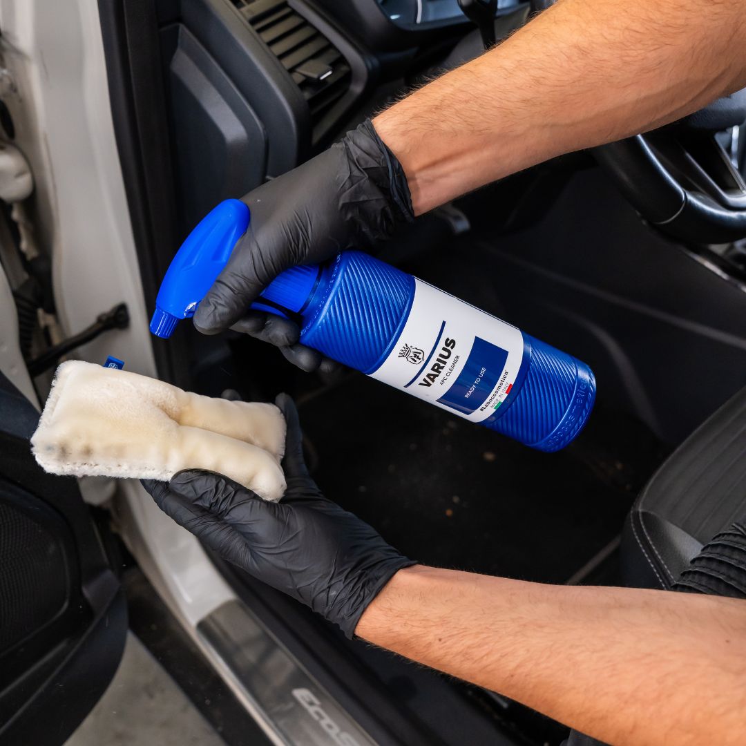 Person cleaning car interior with Varius APC and scrub pad