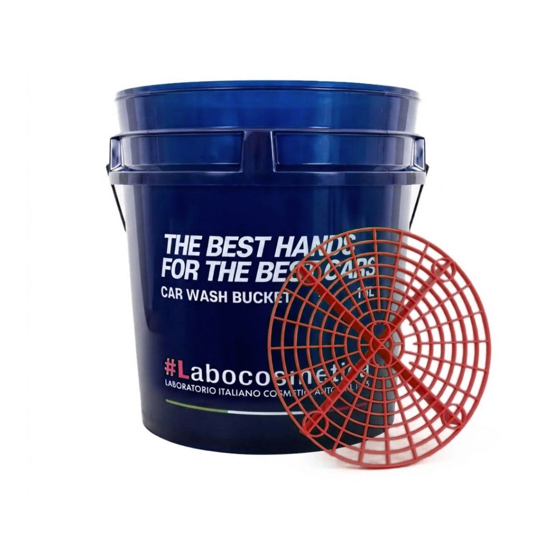 A dark blue plastic Labocosmetica car wash bucket with white text, shown alongside a red circular safety grit guard on a plain white background.