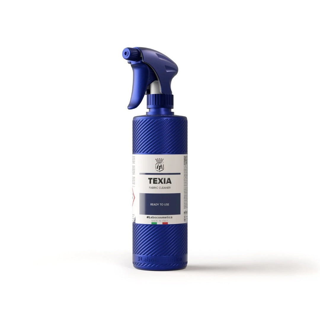 Blue Labocosmetica spray bottle labeled 'Texia' on a white background