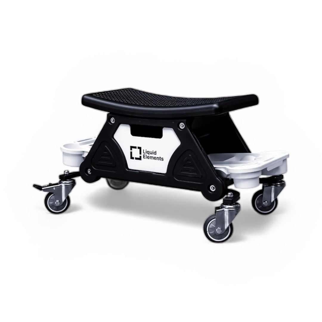 Adjustable step stool with a black platform and white base on a white background
