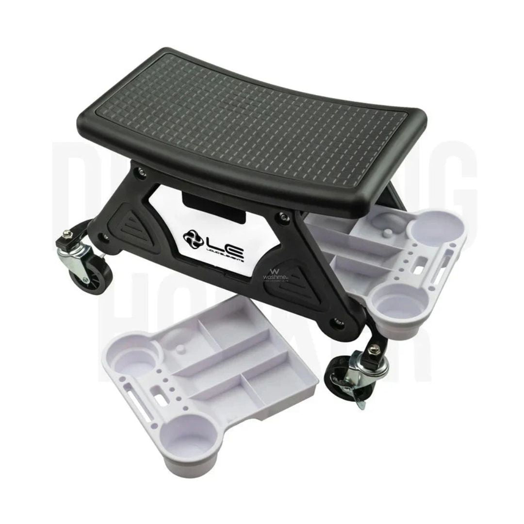 Adjustable step stool with a black platform and white base on a white background