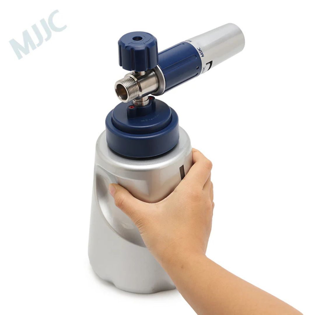 Hand holding a white and blue mjjc pro 3 with a visible brand logo on a white background
