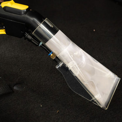 Close-up of a vacuum cleaner head on a black background