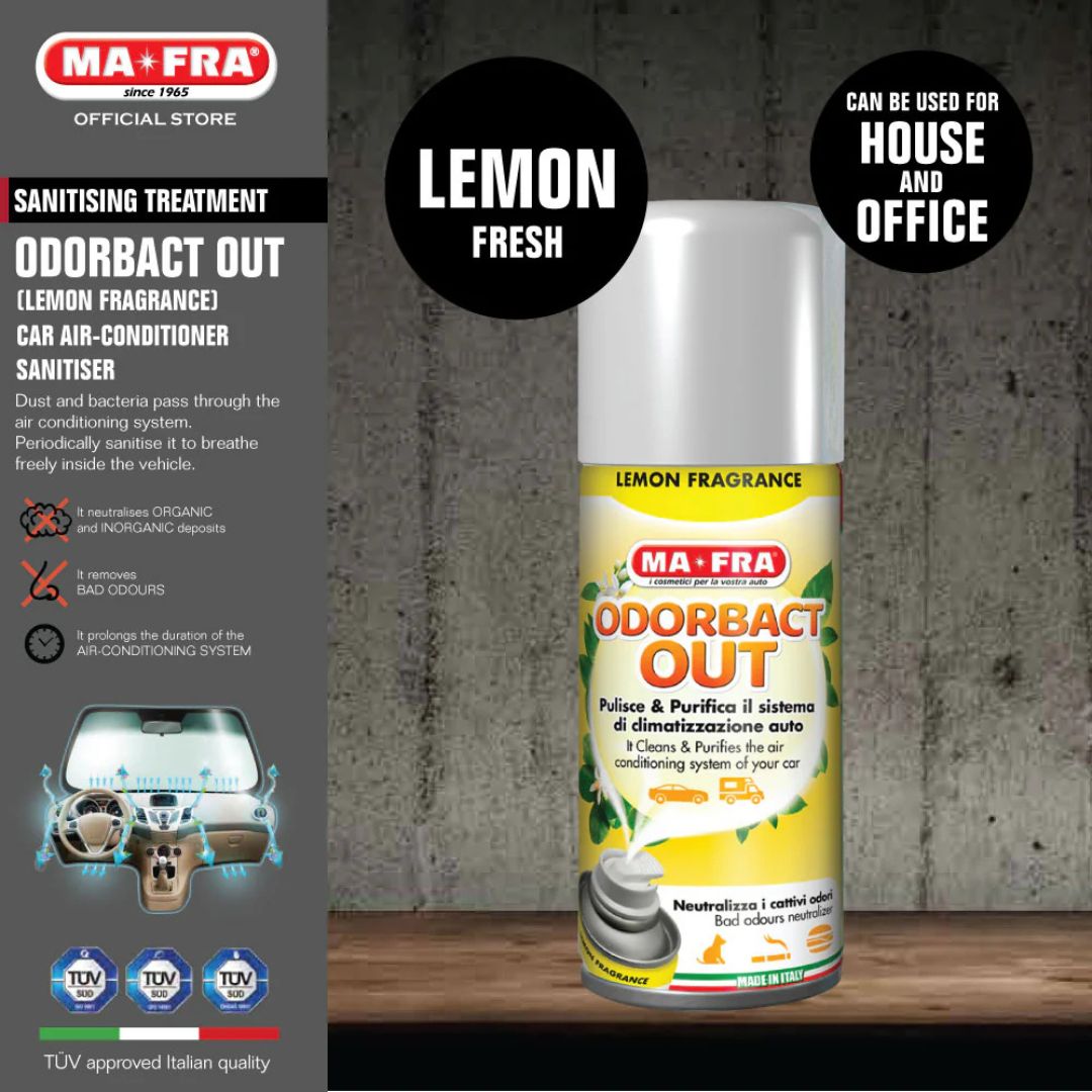MA-FRA Odorabact Out car air conditioner sanitizer can with lemon fragrance on a wooden surface.