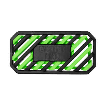 A rectangular black rubber maniac car air freshener with a slotted design, featuring bright neon green accents and a central black block embossed with the brand name 'MANIAC LINE'.