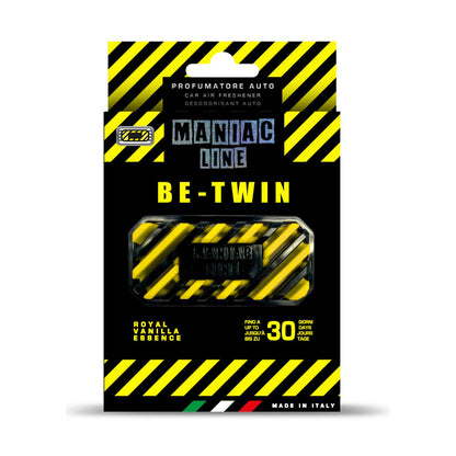 Packaged car air freshener spray labeled 'Maniac Line Be-Twin' , featuring a black and yellow hazard-striped box with a clear window showing the roll of car perfume spray inside.