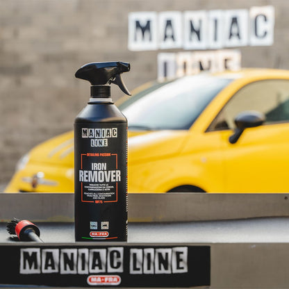 Maniac Line Iron Remover bottle with a yellow Fiat 500 in the background