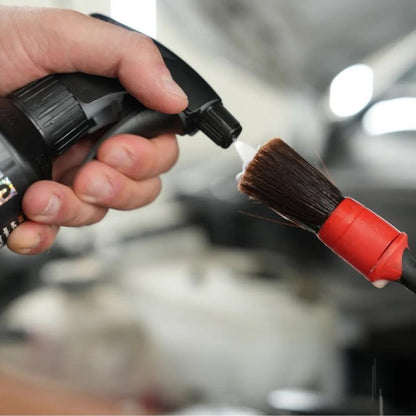Maniac Multisurface Cleaner sprayed on brush