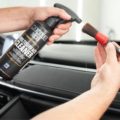 Maniac Multisurface Cleaner sprayed on brush