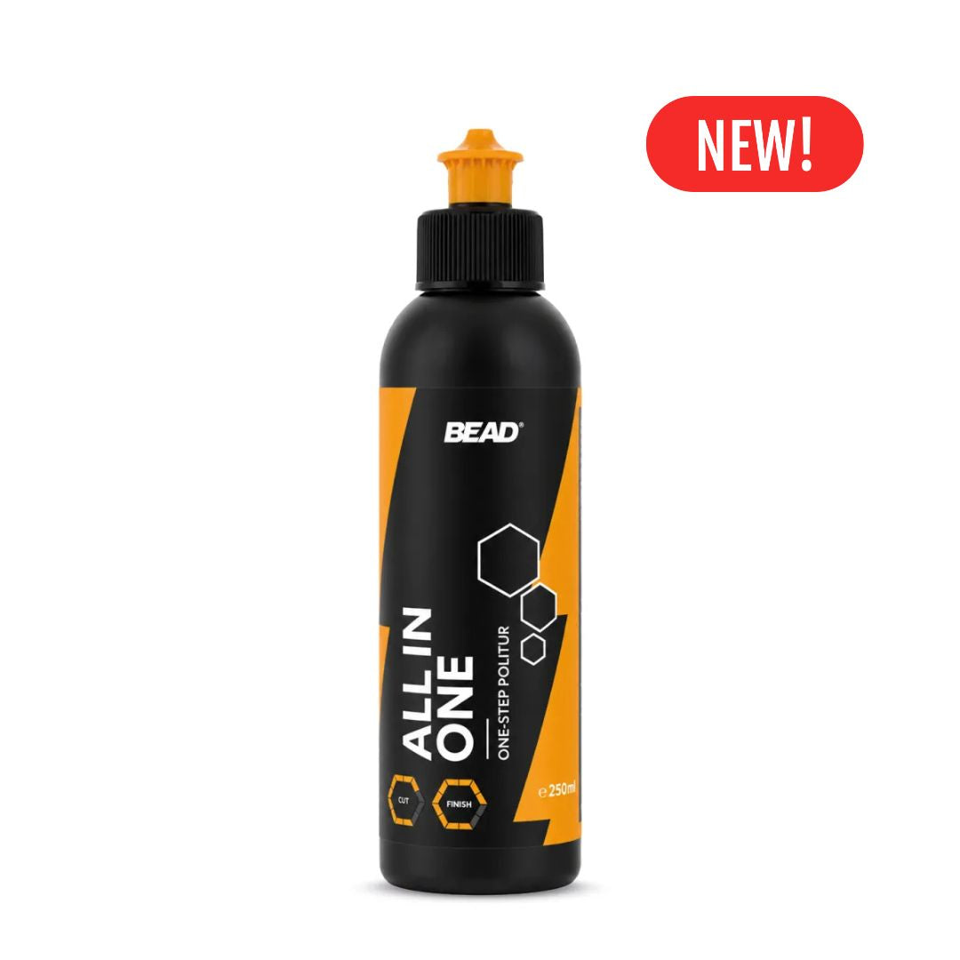A black bottle of BEAD All In One One Step polishing compound with a black pump dispenser, featuring orange and white graphics on the label. A red 'NEW!' badge is displayed in the top right corner against a plain white background.