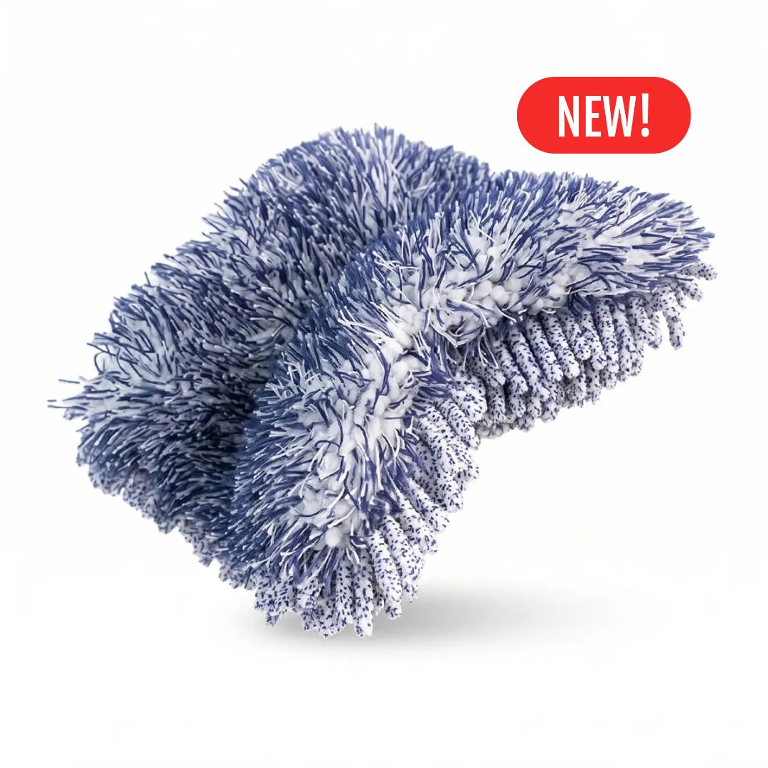 A blue and white textured Labocosmetica Reggy microfibre wash mitt or pad with a red 'NEW!' badge in the top right corner, set against a plain white background.