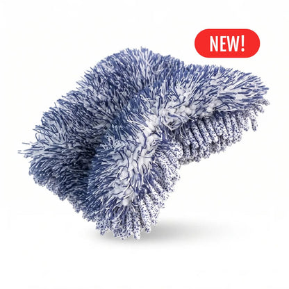 A blue and white textured Labocosmetica Reggy microfibre wash mitt or pad with a red 'NEW!' badge in the top right corner, set against a plain white background.