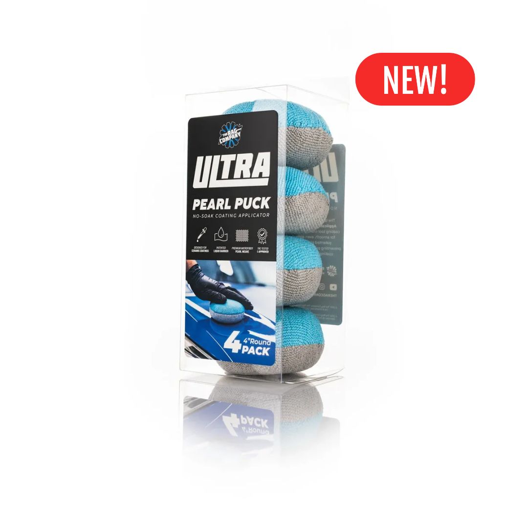 The Rag Company Puck Ultra Pearl Puck 4-pack car polishing cloth in a clear plastic box with a black and blue label, featuring a red 'NEW!' badge on a white background.