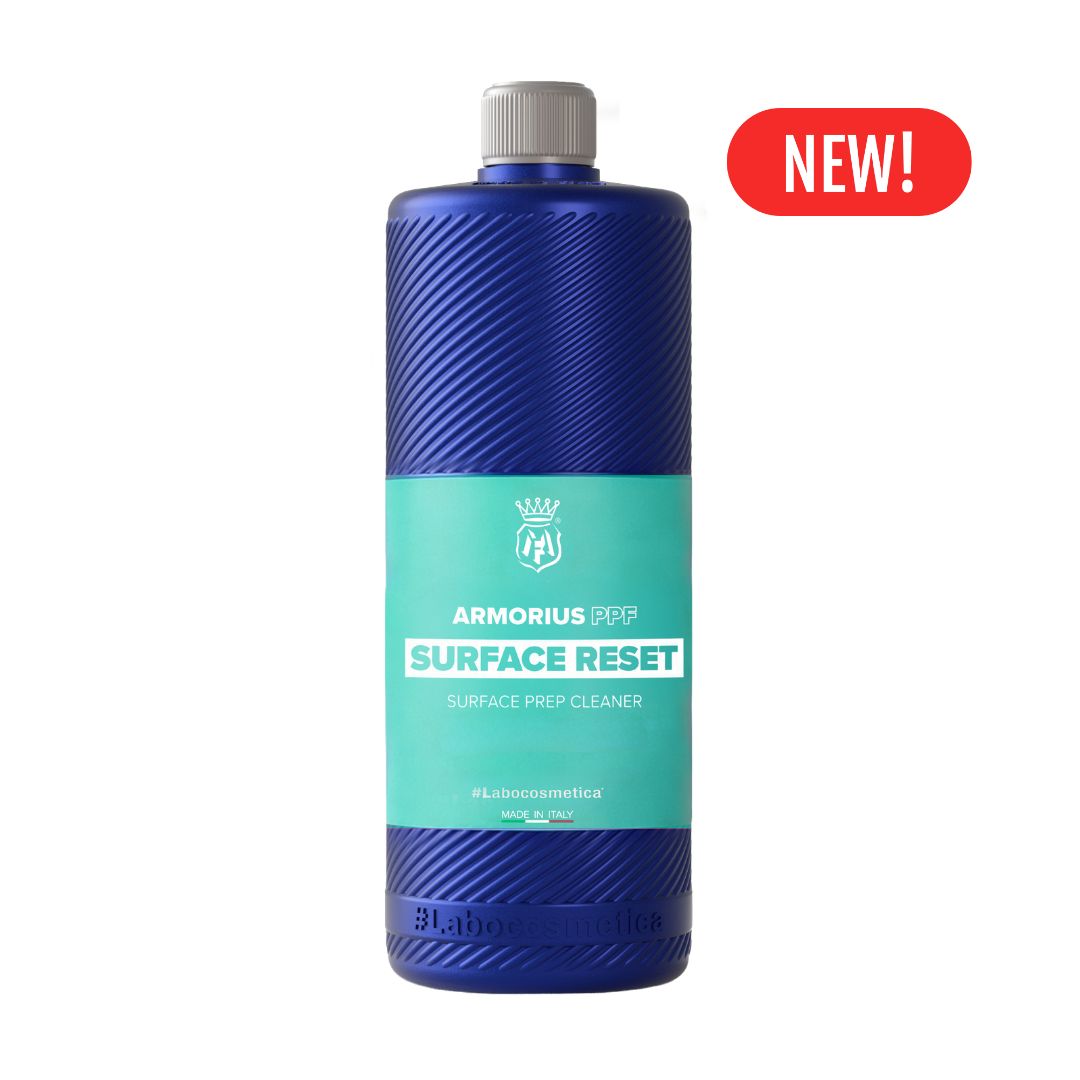 A 1L bottle of Labocosmetica Armorius Surface Reset surface prep cleaner, featuring a textured blue bottle with a teal label and a grey cap, shown on a white background with a red 'NEW!' badge.