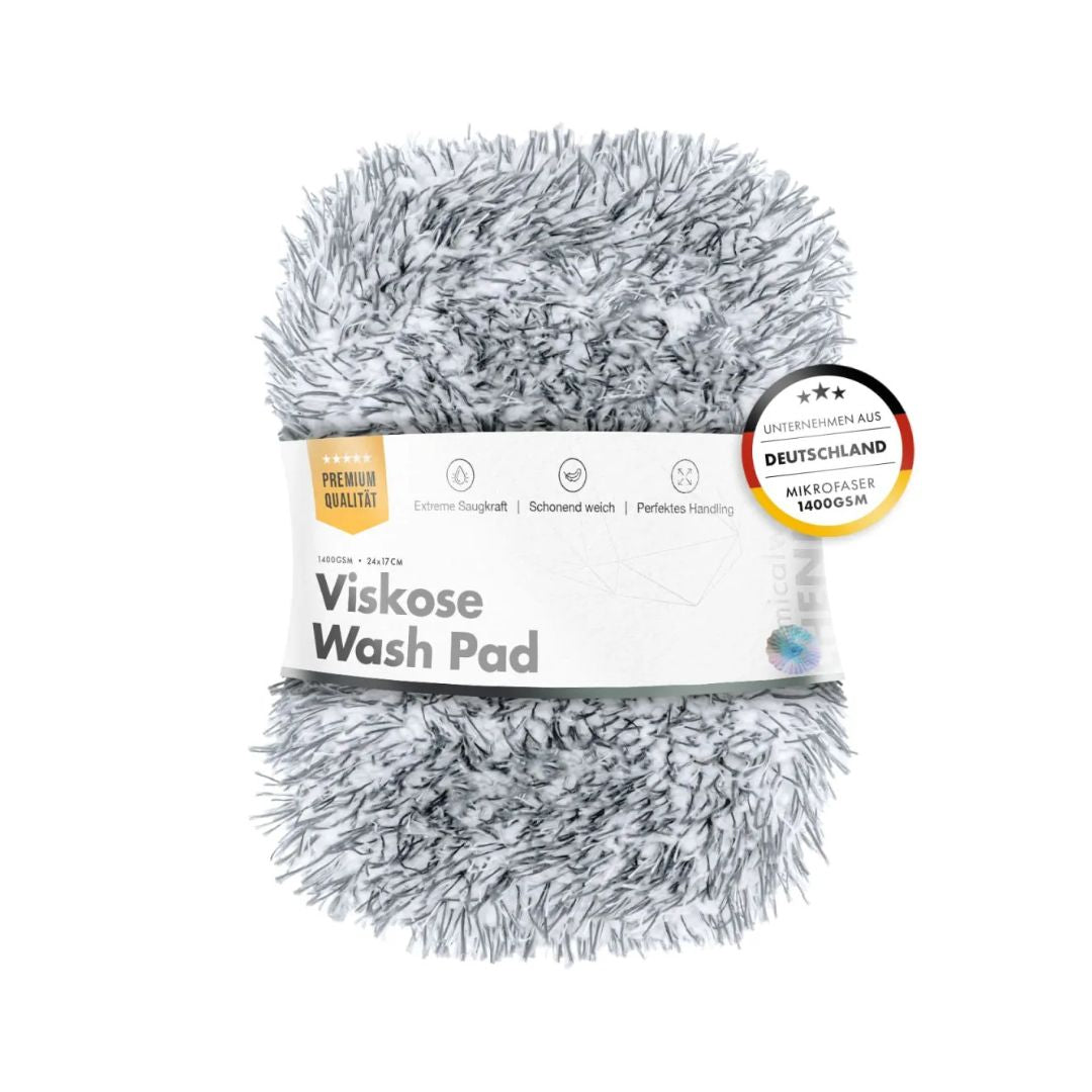 A gray and white shaggy Viskose Wash Pad wrapped in a white paper band with German text, featuring a circular 'Bestseller Deutschland' badge on the right.