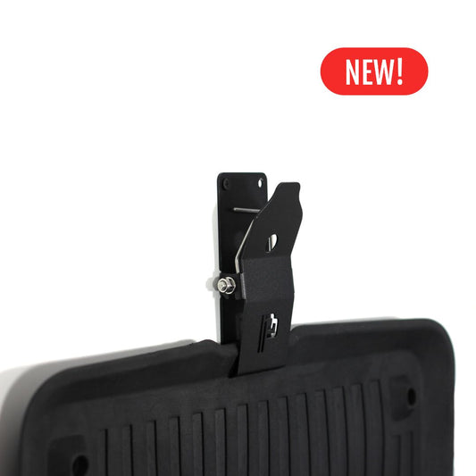 Black Poka Premium mat holder attached to a black car mat with a red 'NEW!' label on a white background