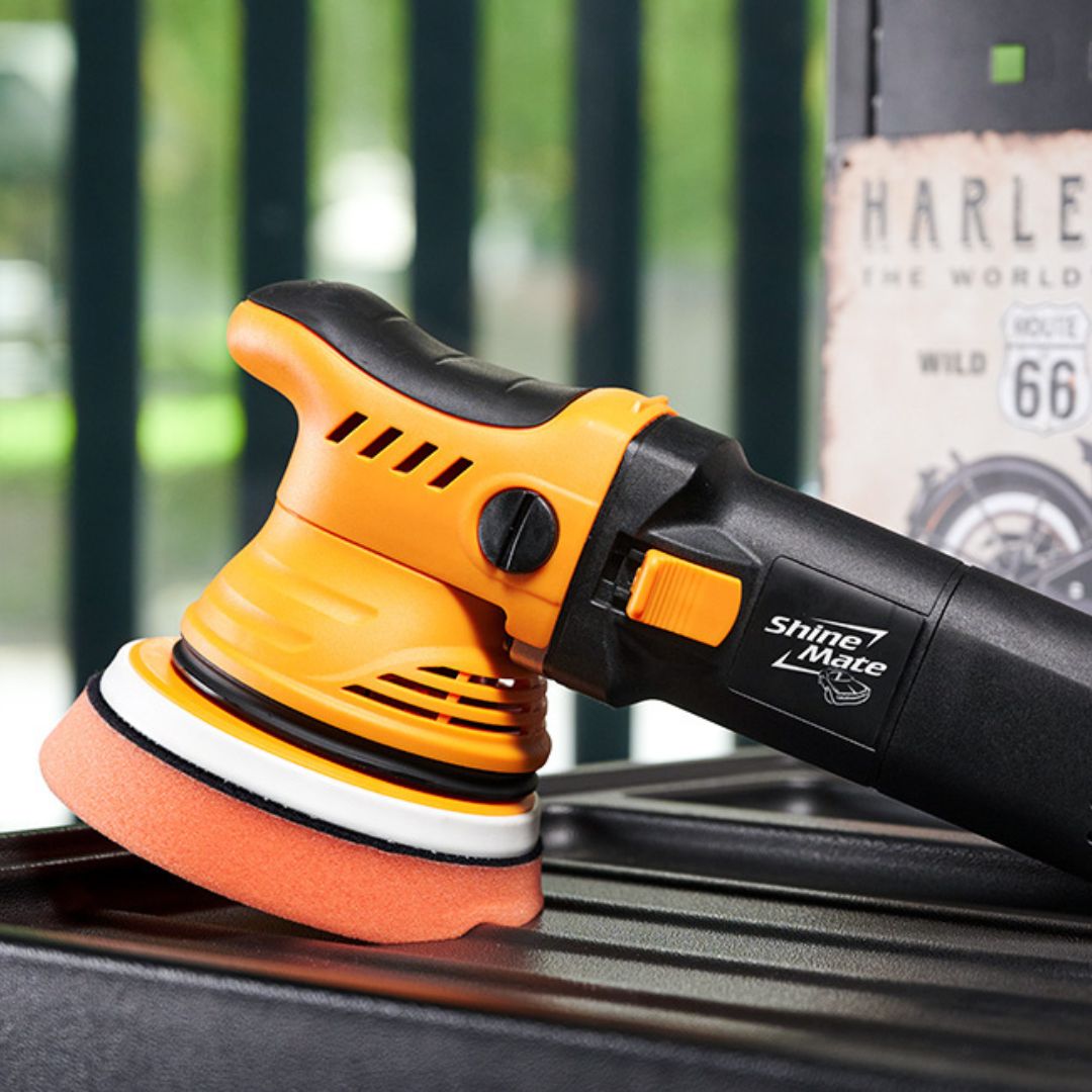 Shinemate ERO600 G2 car polisher on a car surface with a blurred background