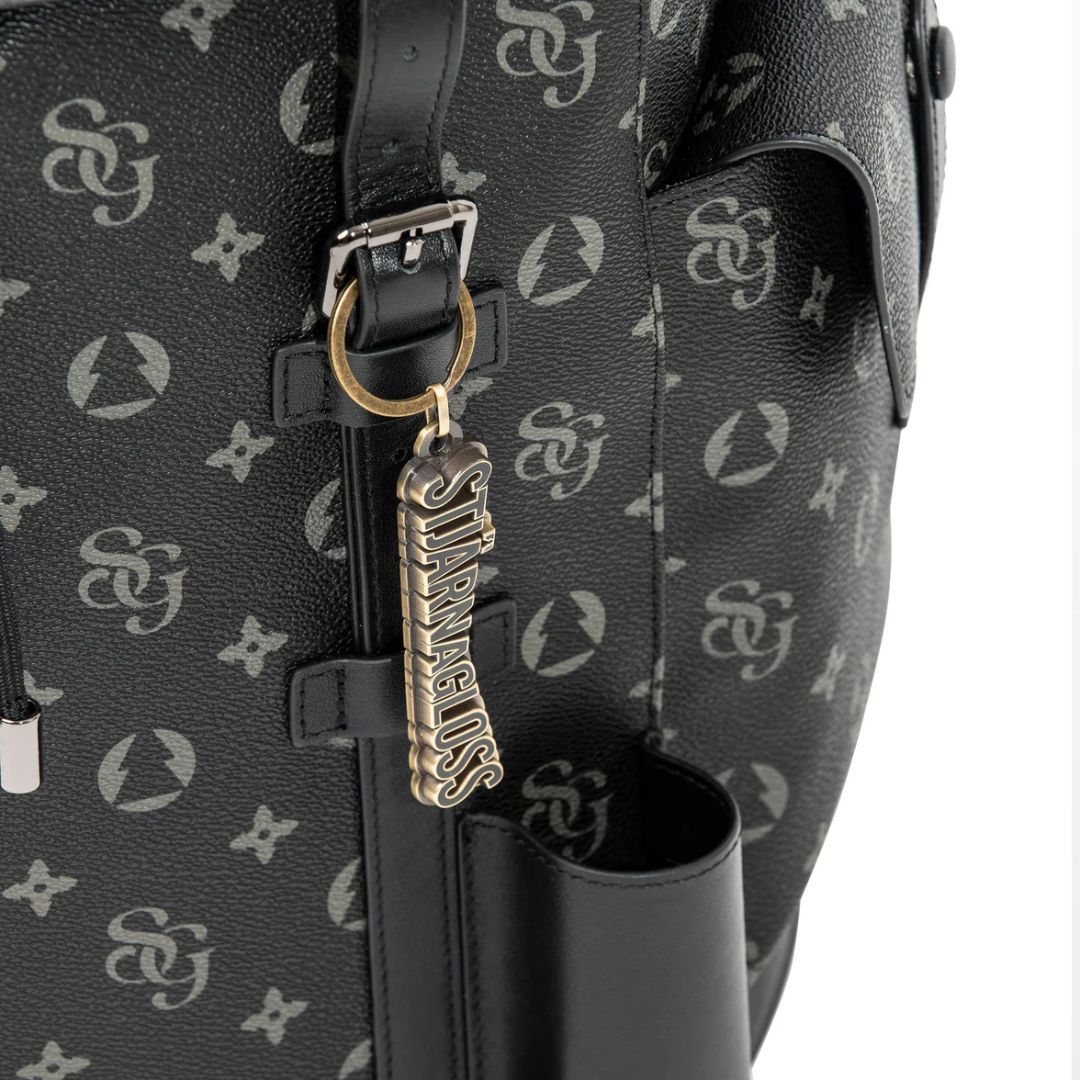 Black leather bag with gold tag featuring 'Starbucks' logo on a white background