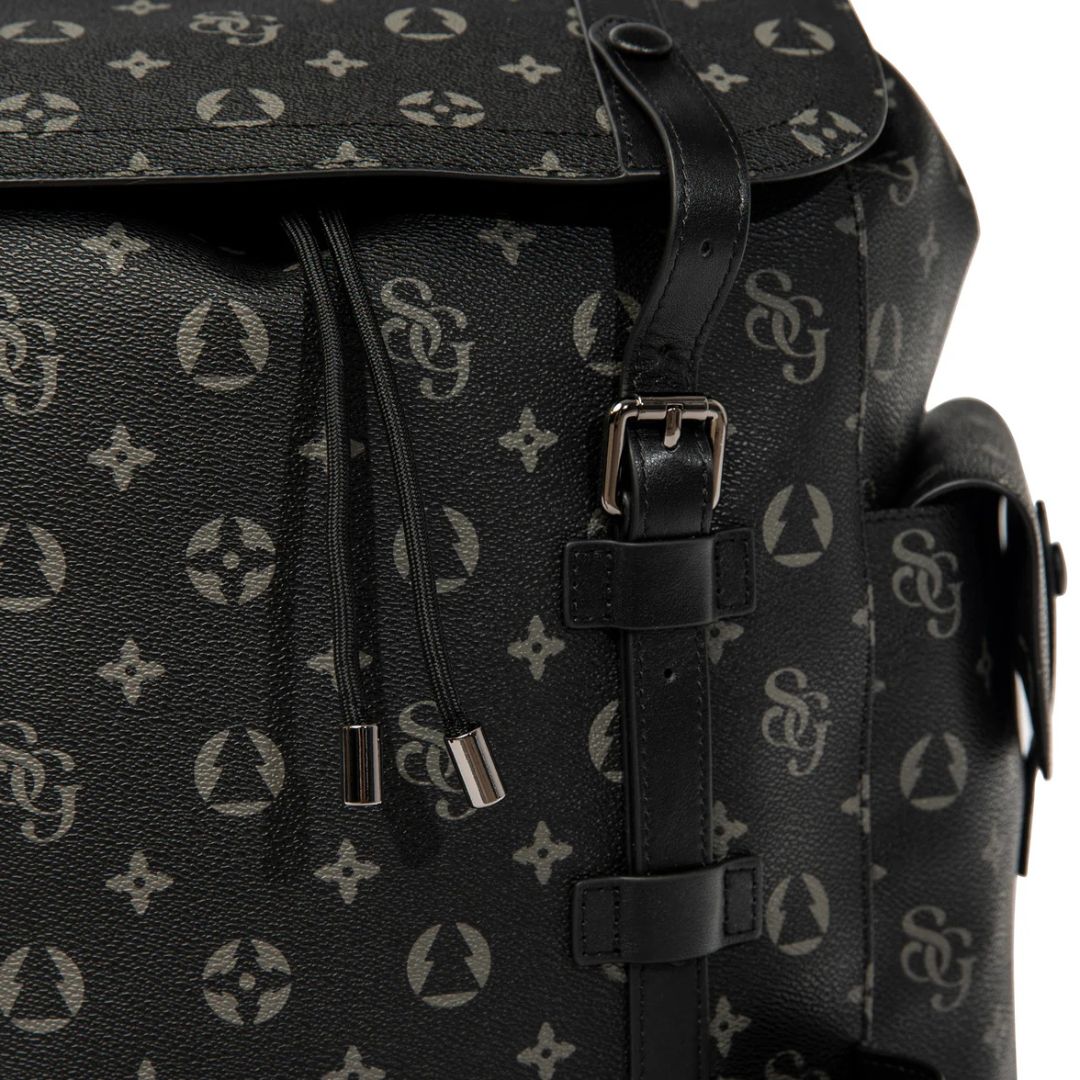 Black backpack with a patterned design on a white background