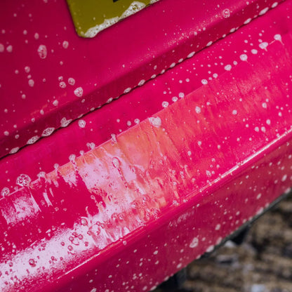 Close-up of a pink BMW M2 with white Stjarnagloss Forst suds