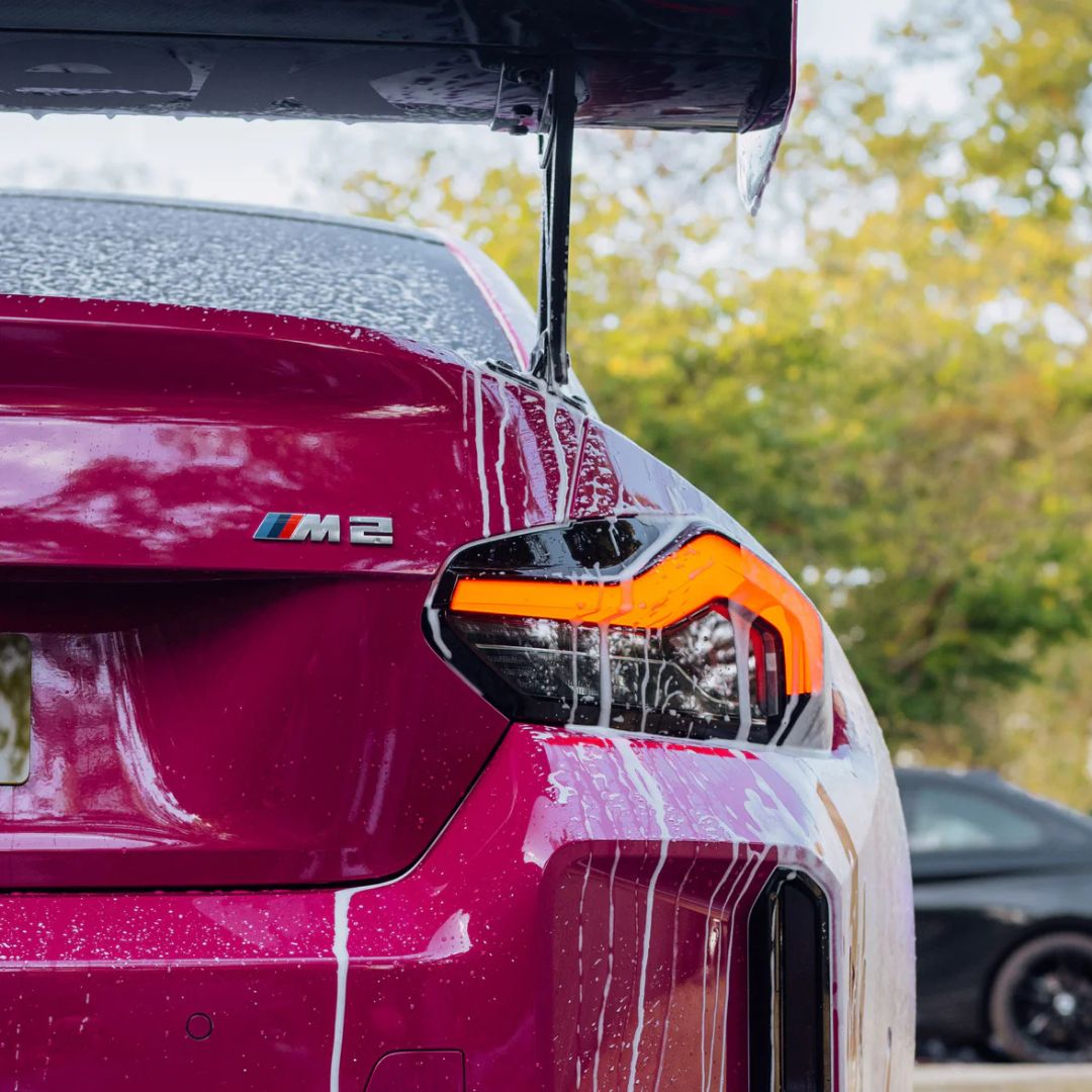 Close up of a pink BMW M2 and Stjarnagloss Sno - pH-Neutral Snow Foam