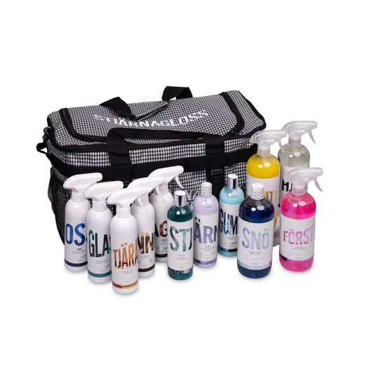 Stjarnagloss Kit Set of cleaning bottles with visible brand names and a checkered bag on a white background