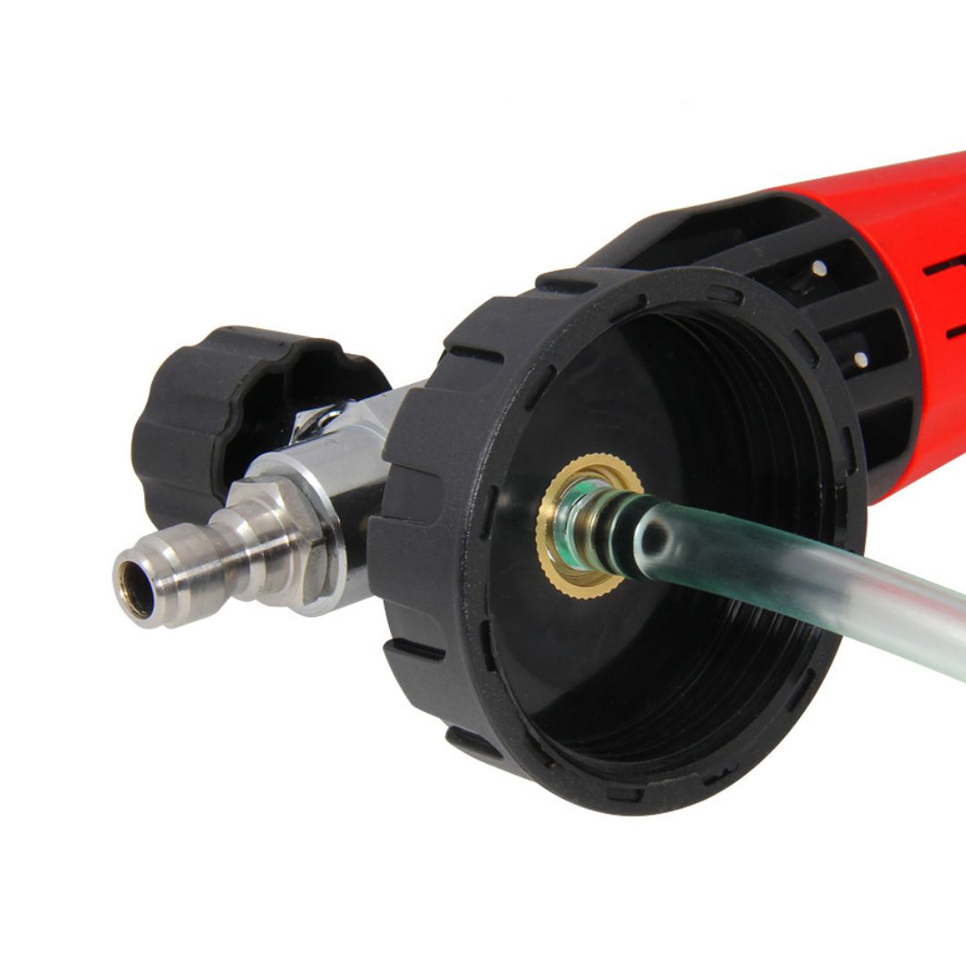 Close-up of a pressure washer nozzle with a hose on a white background