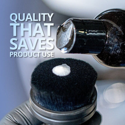 Close-up of a black brush with a white bristle tip and text 'Quality That Saves Product Use' on a gray background.