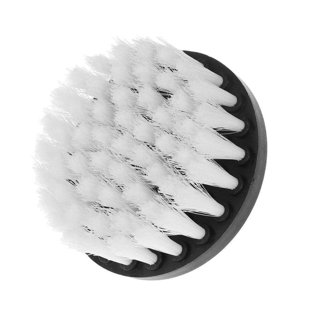 A close-up of a round black brush head with dense white bristles, shown on a plain white background.