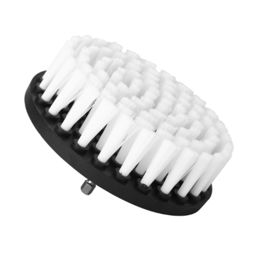 A black oval cleaning brush head with dense white bristles, shown on a plain white background.