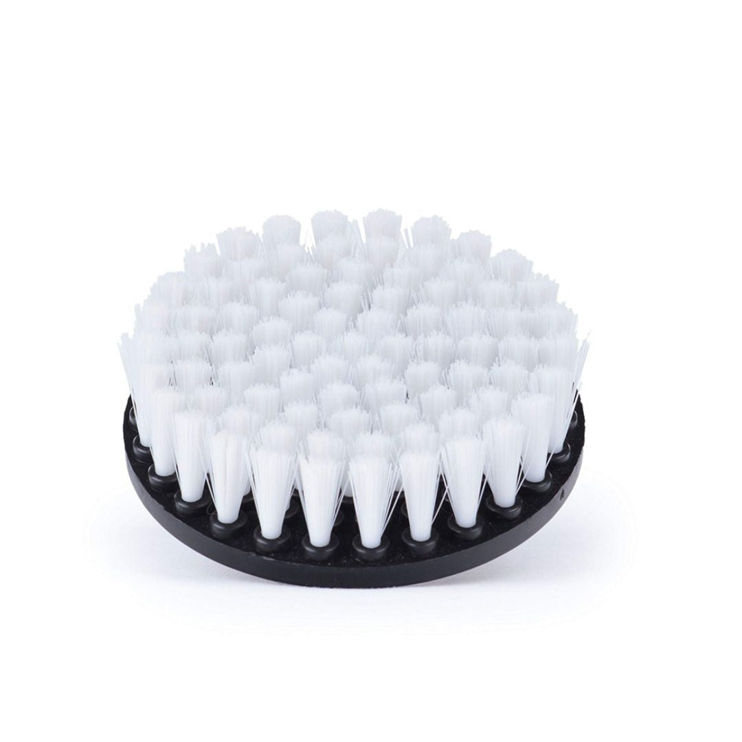 White bristle brush on a black base against a white background