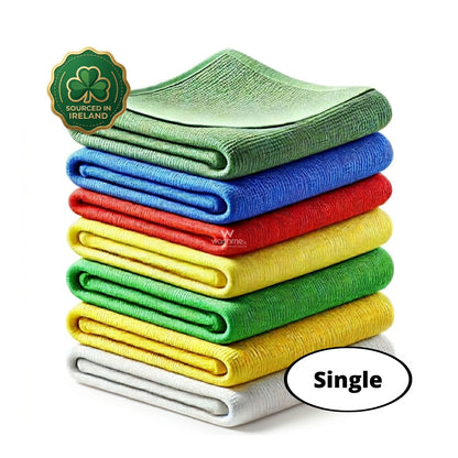 Stack of colourful folded washme microfibre cloths with a green shamrock logo and 'Sourced in Ireland' text on a white background.