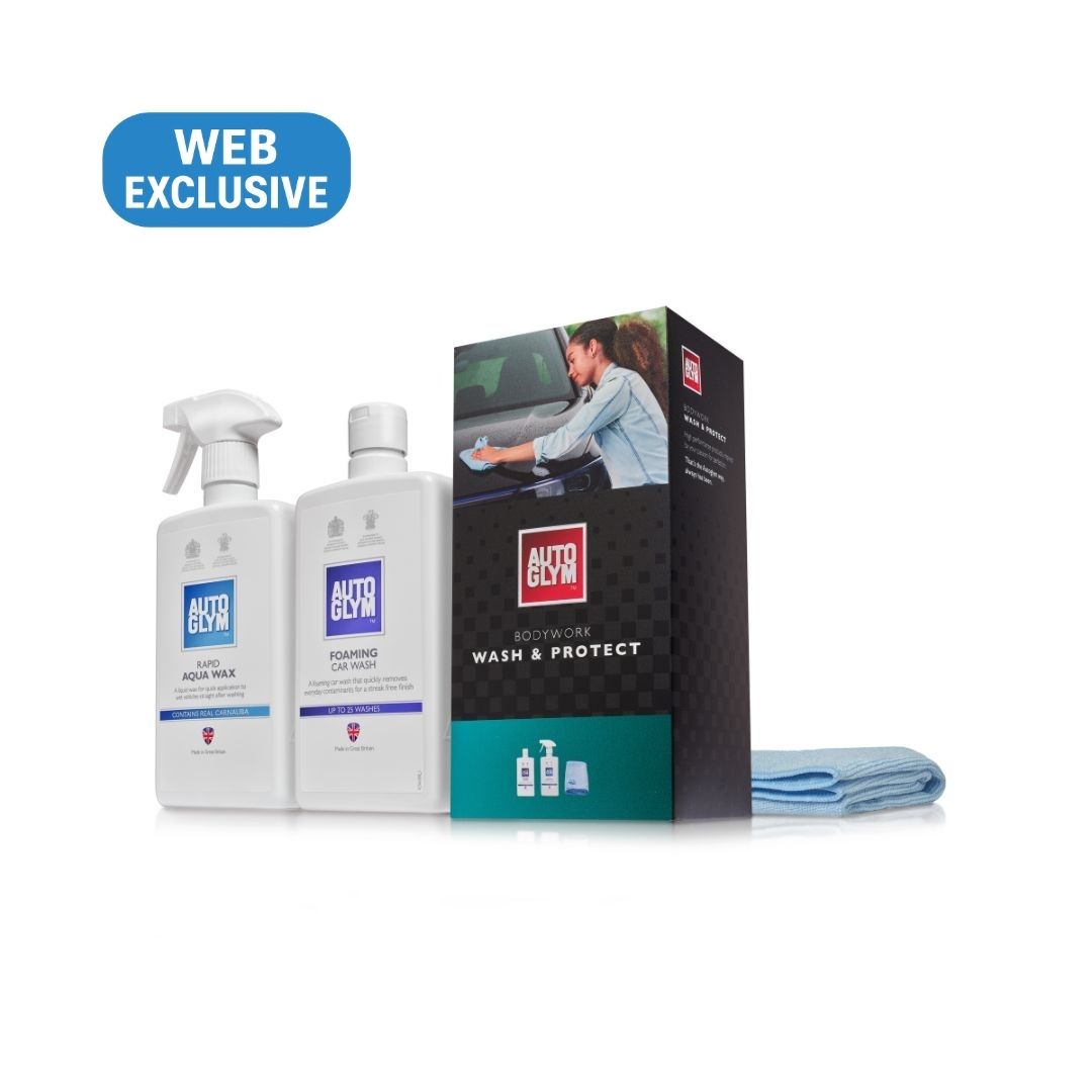 Autoglym Car Wash & Protect kit including two white bottles (Car Wash Pack and Foaming Agent), a black and teal product box, and a blue microfiber cloth, with a blue 'WEB EXCLUSIVE' badge on a white background.