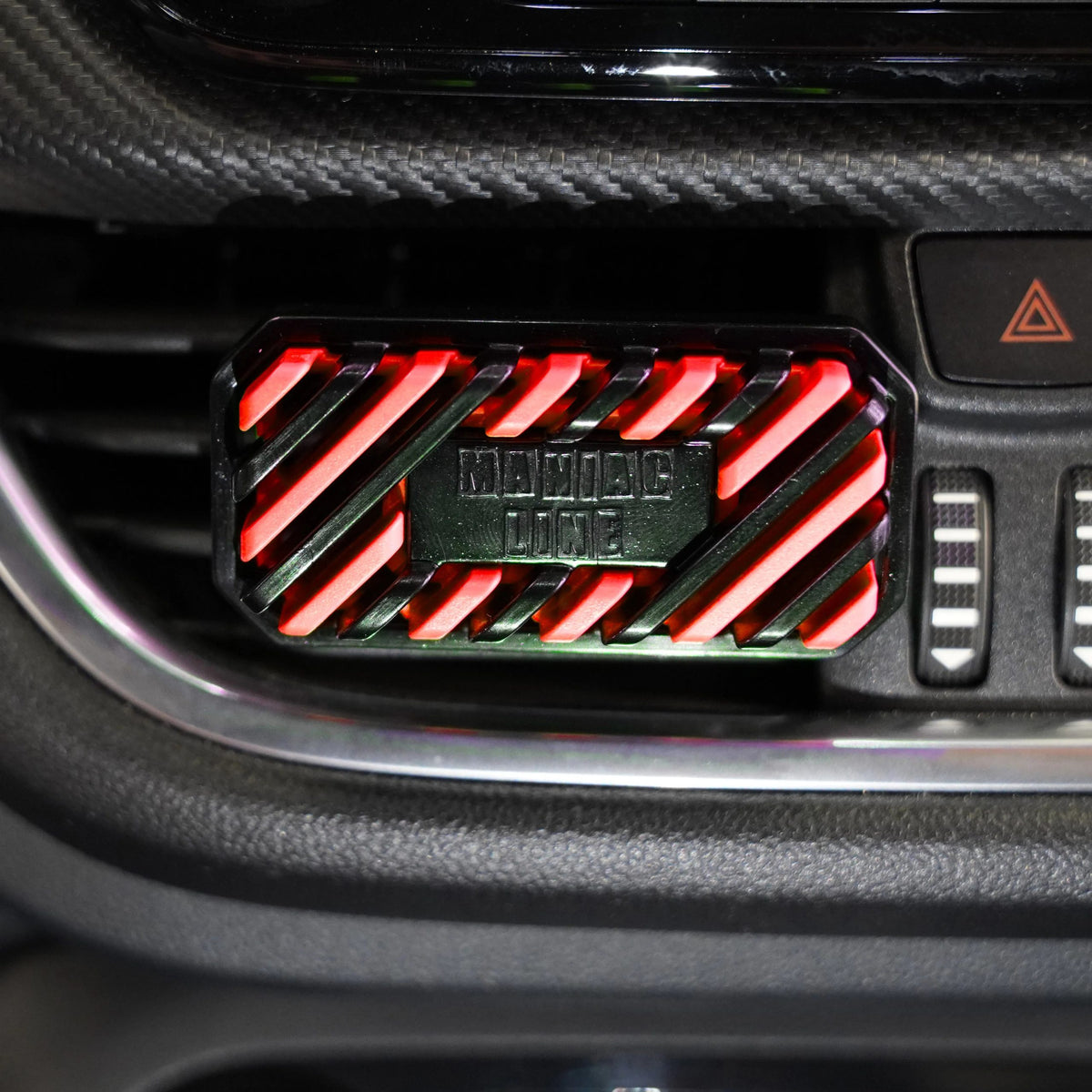 A close-up of a black car air freshener plug with red LED strip lighting, featuring the text 'MORNING DAZE' on the front.