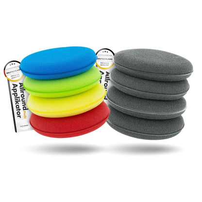 Stack of colorful foam applicators and gray foam pads on a white background. chemicalworkz