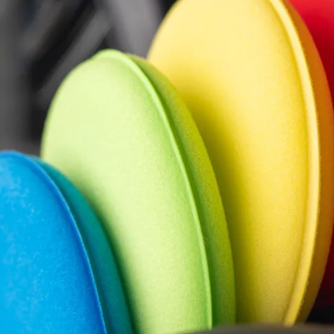 Close-up of colorful applicators stacked together. chemicalworkz applicator