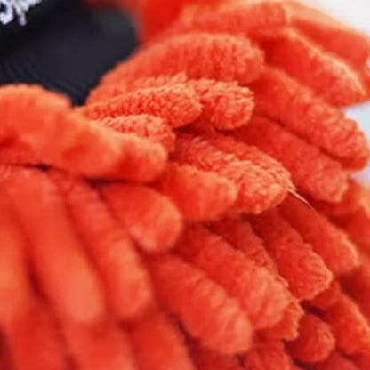 Close-up of orange cleaning mitts with a blurred background