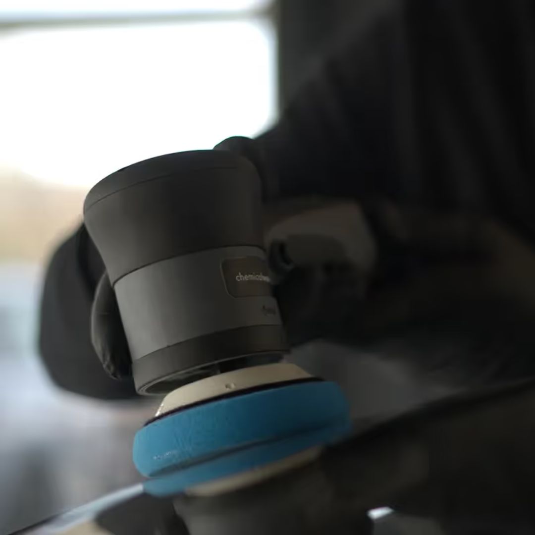 Car polisher attached to a car's interior mirror