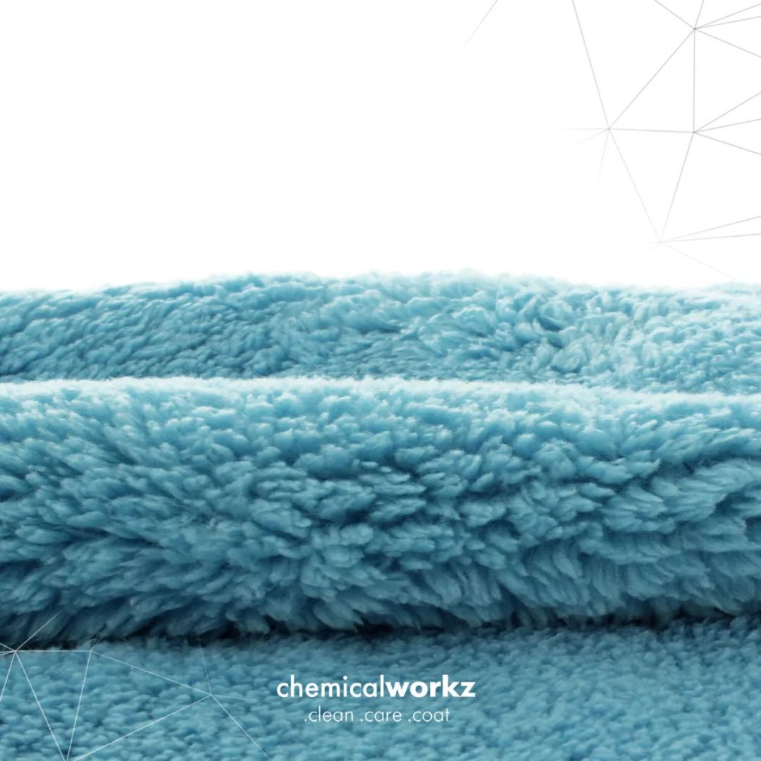 Stack of blue textured cloths with 'chemicalworkz' branding on a white background